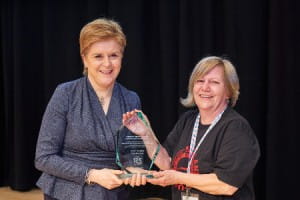 First Minister presenting the Learner of the Year Award to Joan Tasker of Unite the Union
